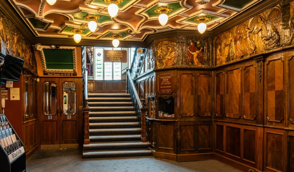 Interior of foyer, seats leading down to the theatre shop