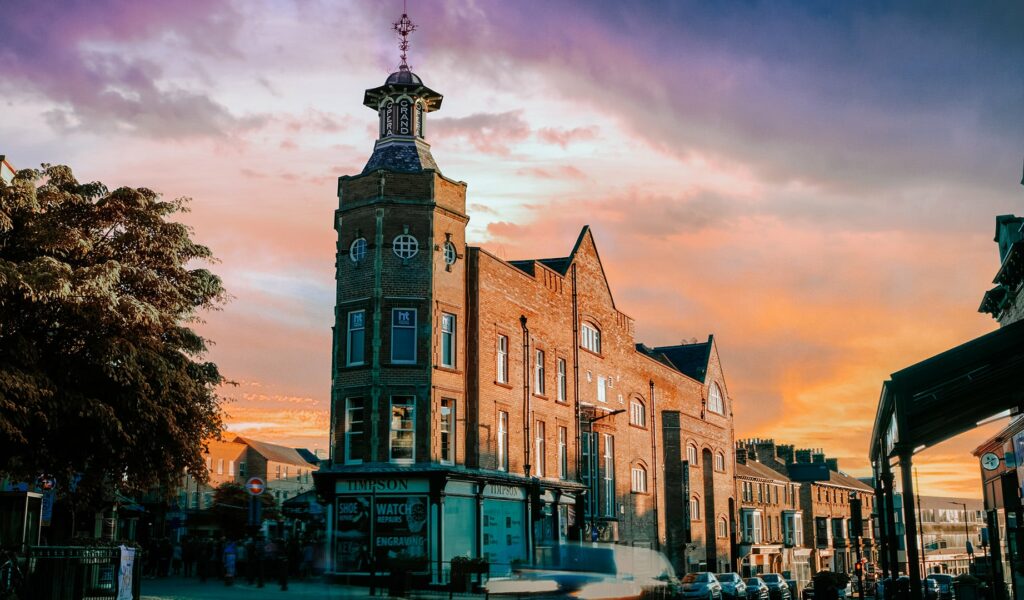 Exterior of Harrogate Theatre with sunset in background